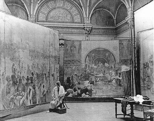 Photo: The Czech painter Alfons Mucha at work on the 'Slav Epic', 1920.
Image source Radio Prague; Rezonansowy 2013 commons.wikimedia